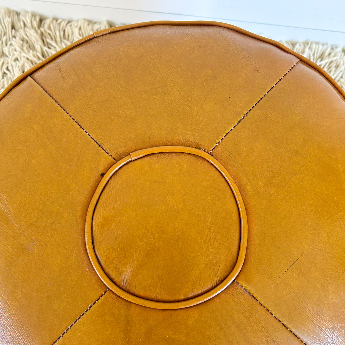 ORANGEY BROWN VINYL FOOTSTOOL