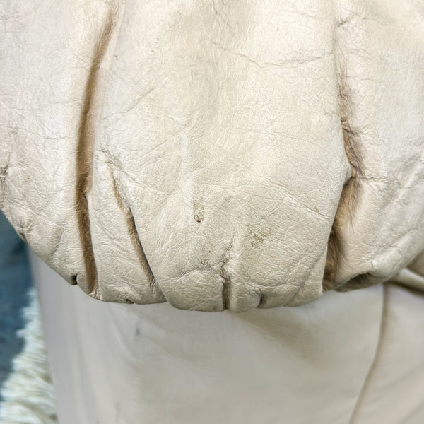 PEACHY PINK LEATHER ARMCHAIRS