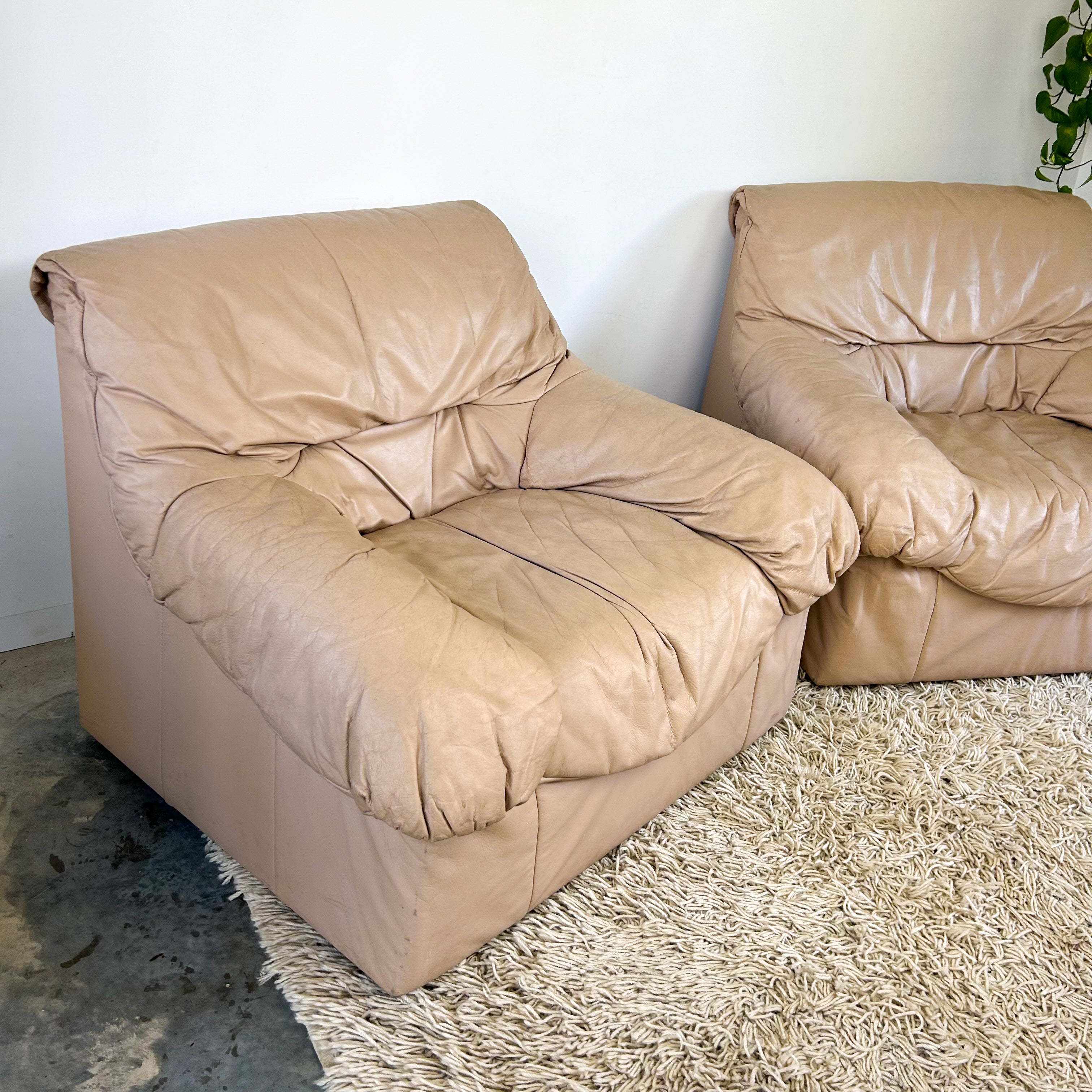 PEACHY PINK LEATHER ARMCHAIRS