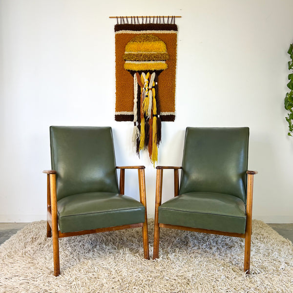MID CENTURY GREEN VINYL ARMCHAIRS