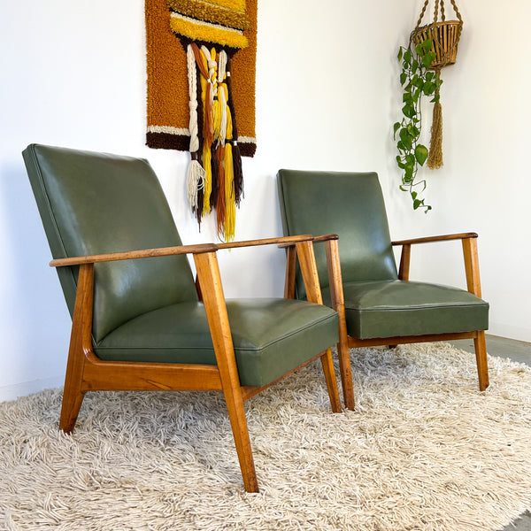 MID CENTURY GREEN VINYL ARMCHAIRS