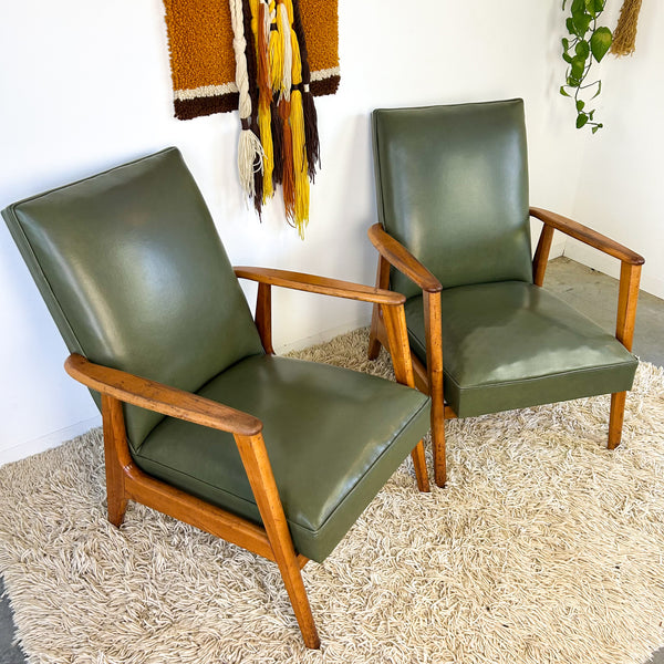 MID CENTURY GREEN VINYL ARMCHAIRS
