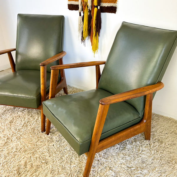 MID CENTURY GREEN VINYL ARMCHAIRS