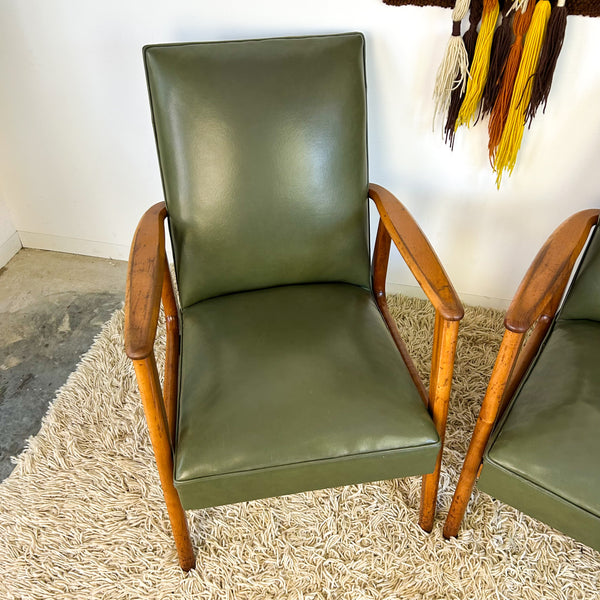 MID CENTURY GREEN VINYL ARMCHAIRS