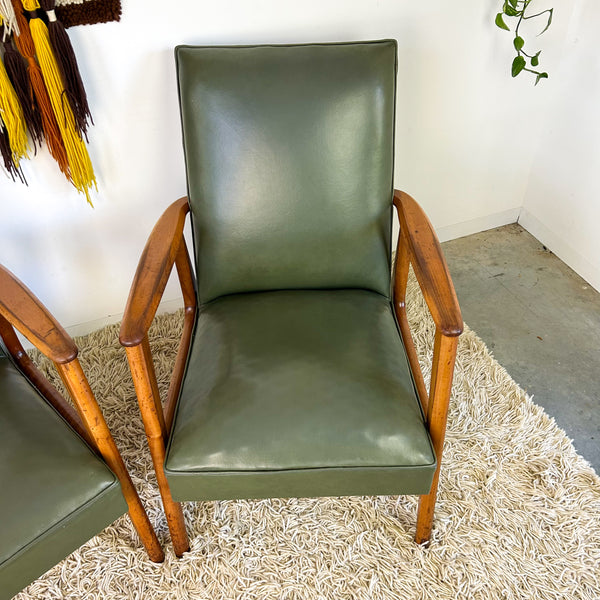MID CENTURY GREEN VINYL ARMCHAIRS