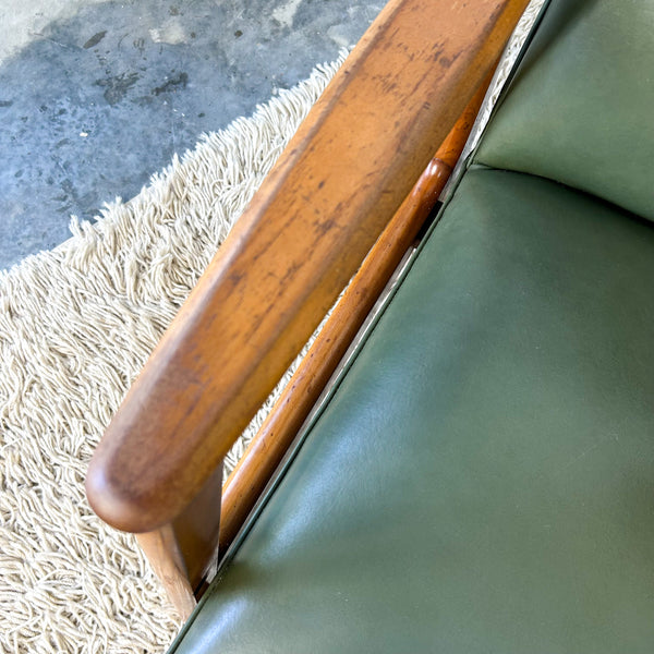 MID CENTURY GREEN VINYL ARMCHAIRS