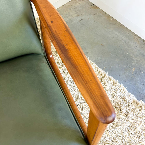 MID CENTURY GREEN VINYL ARMCHAIRS