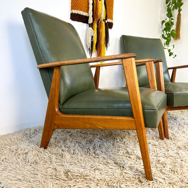 MID CENTURY GREEN VINYL ARMCHAIRS