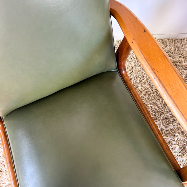 MID CENTURY GREEN VINYL ARMCHAIRS