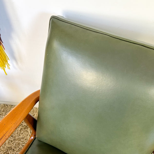 MID CENTURY GREEN VINYL ARMCHAIRS