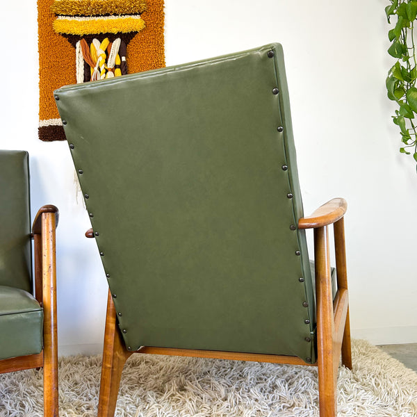 MID CENTURY GREEN VINYL ARMCHAIRS