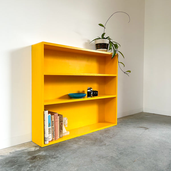 YELLOW WOODEN BOOKCASE